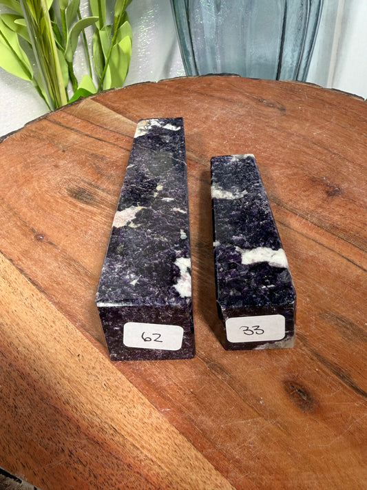 Dark lepidolite with pink tourmaline towers
